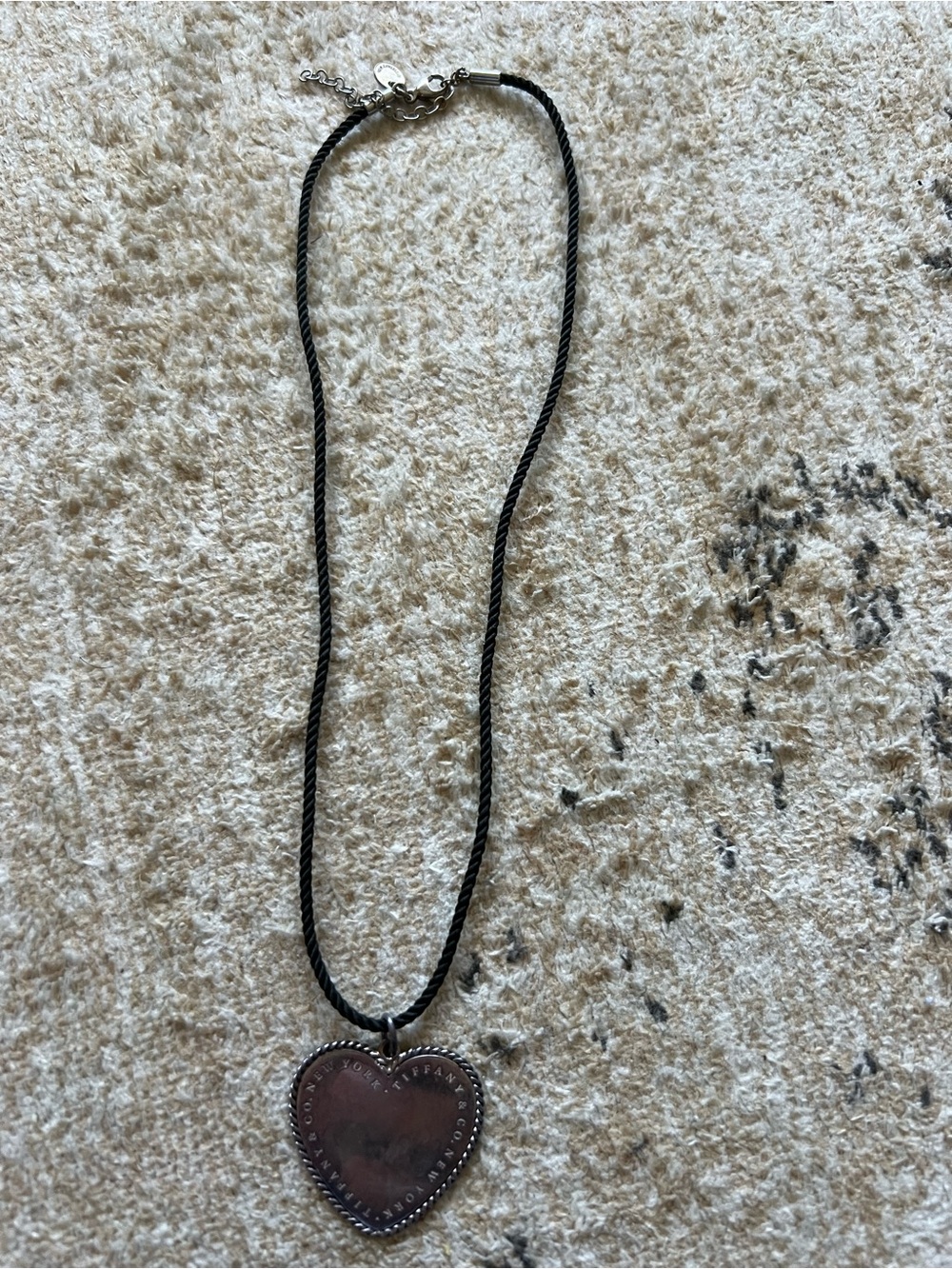 Tiffany & Co twist heart pendant on black cord
